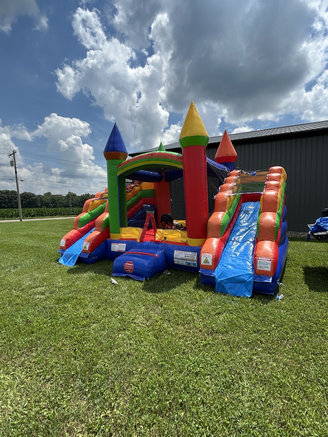 Colorful Riverstone bounce house with two slides